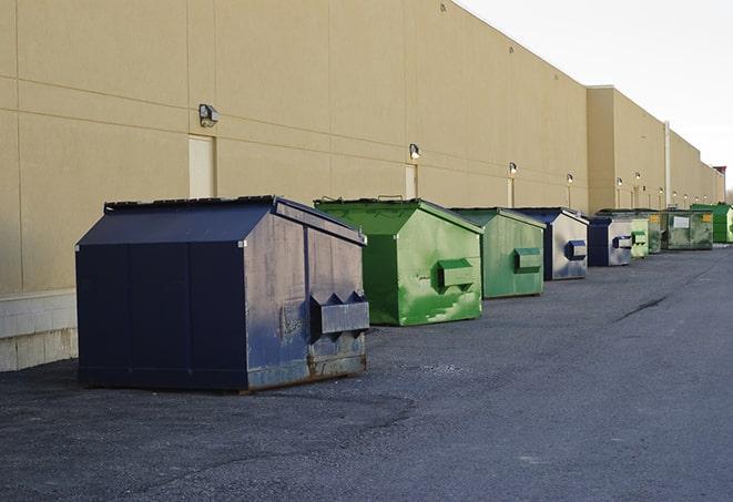 large construction waste containers in a row at a job site in Crestview FL